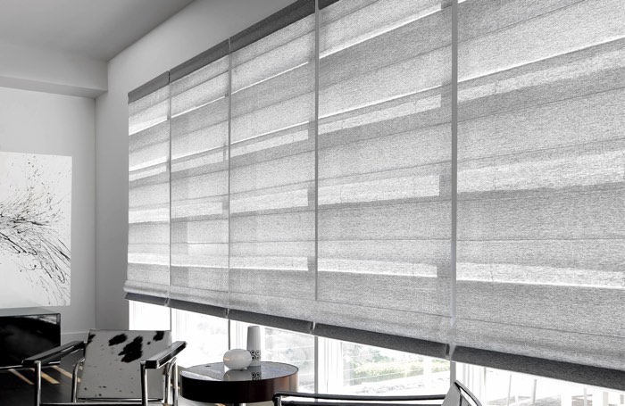 Gray shades covering wide business window